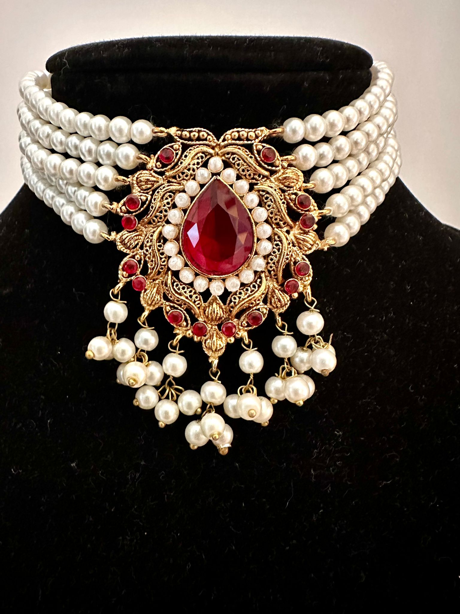 Na’aira- Pearl chokar set with maroon(deep red) stones